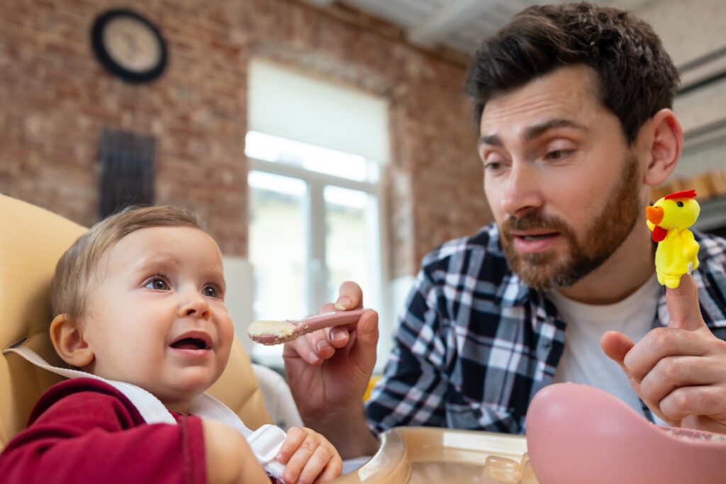 A parent struggles to interest his kid in food