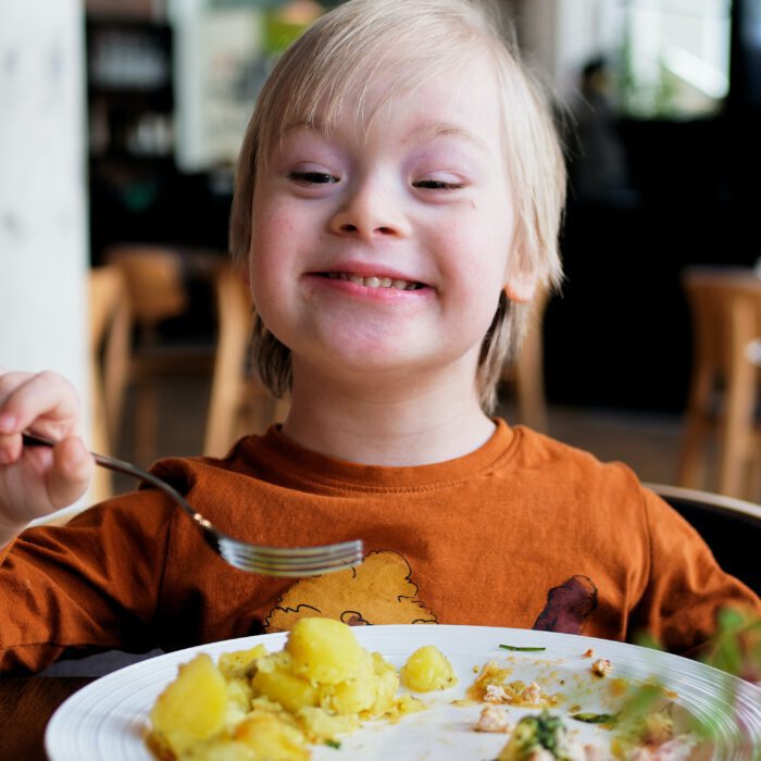 Smiling kid eating