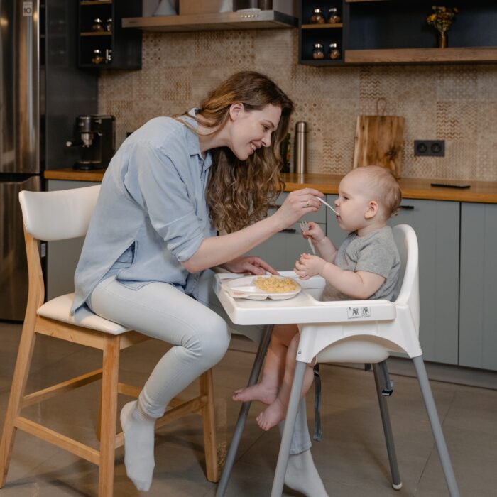 A mom feeds her baby